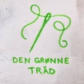 Den Grønne Tråd logo
