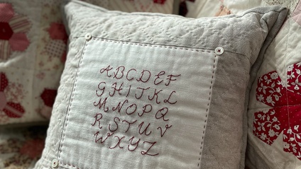 Product image for The Schoolhouse Alphabet Sampler Cushion PDF Pattern